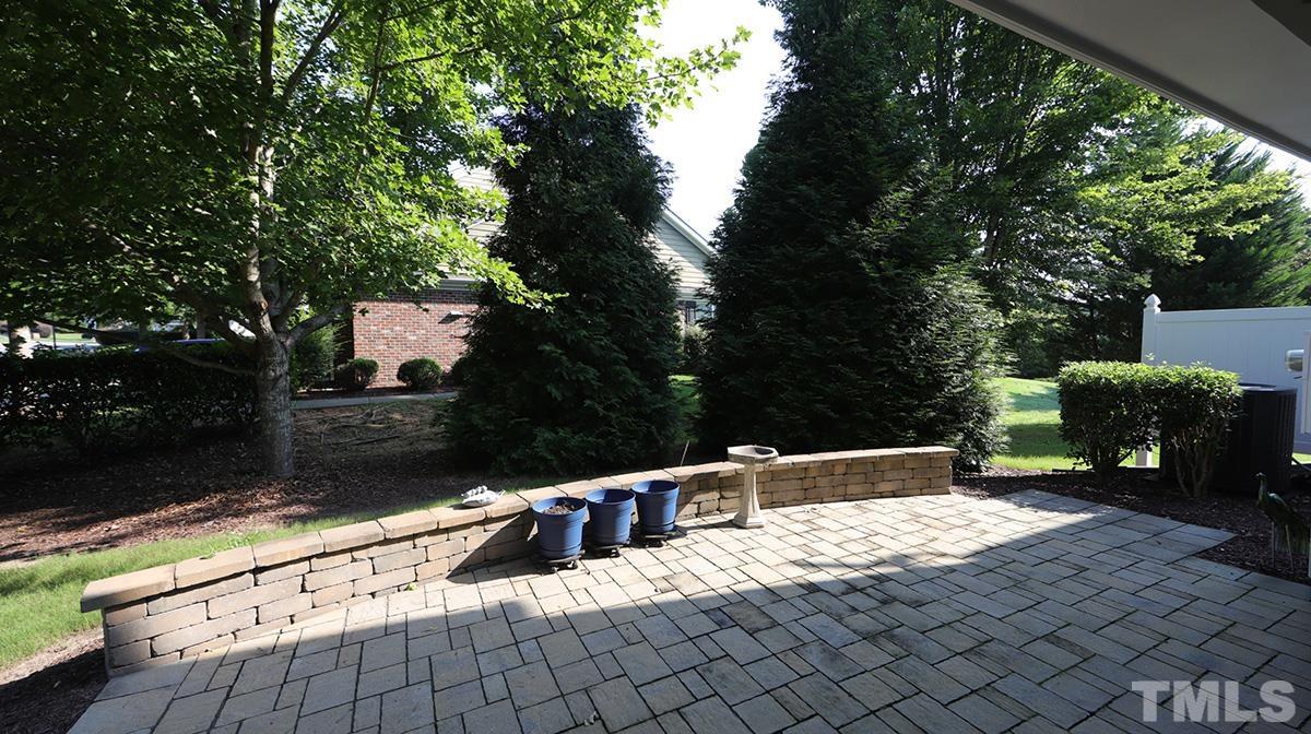 301 Dimock Way Wake Forest, NC 27587 - Photo 13 of 14 Custom stone paver patio is covered and provides a wonderful outdoor retreat