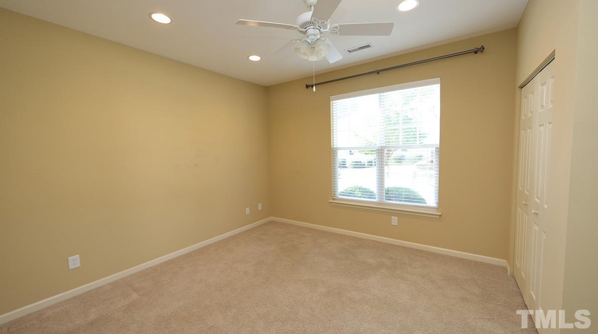 301 Dimock Way Wake Forest, NC 27587 - Photo 7 of 14 Bedroom on first floor has access to full bath and makes a wonderful flex-room.