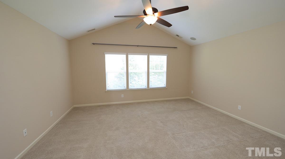 301 Dimock Way Wake Forest, NC 27587 - Photo 9 of 14 Primary bedroom has vaulted ceiling and two master closets.