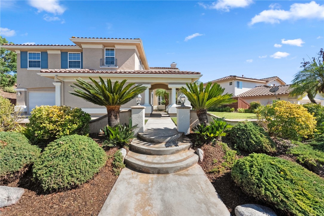31465 Inverness Court Temecula, CA 92591 - Photo 6 of 75 Inviting front steps framed by manicured landscaping lead to the homes impressive entry.