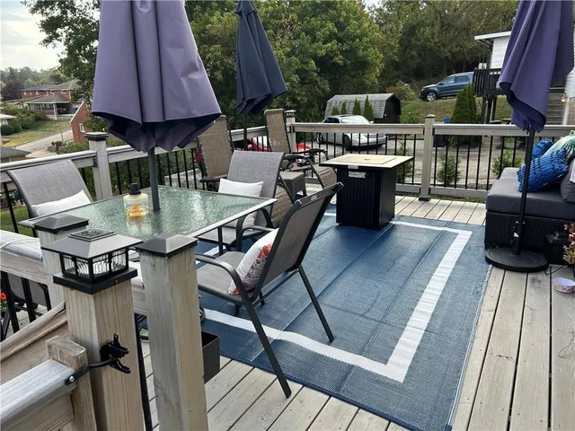a terrace of a house with outdoor seating