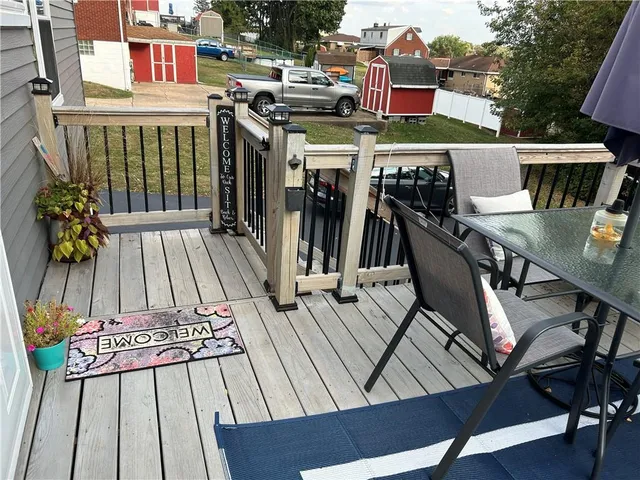 a view of a deck with furniture