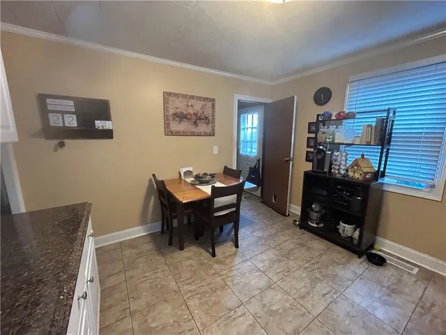 a view of a workspace with furniture