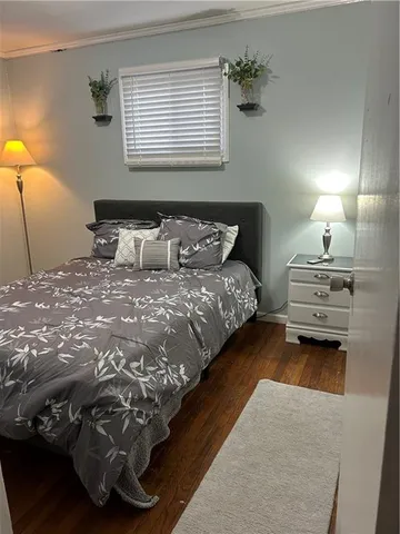 a bedroom with a bed and a lamp