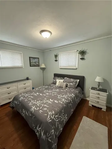 a bedroom with bed and window