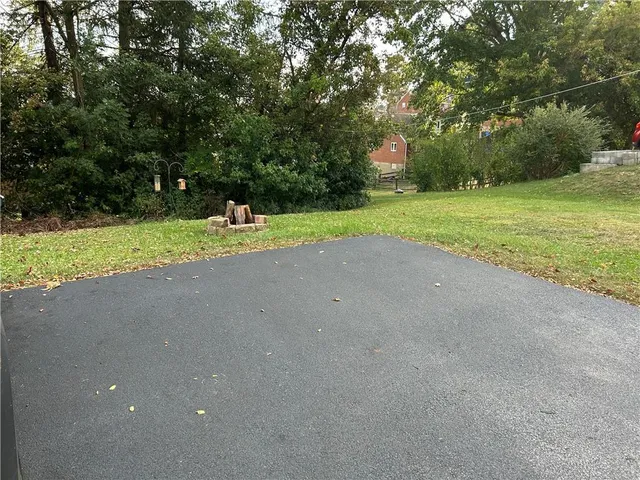 a view of a park with large trees