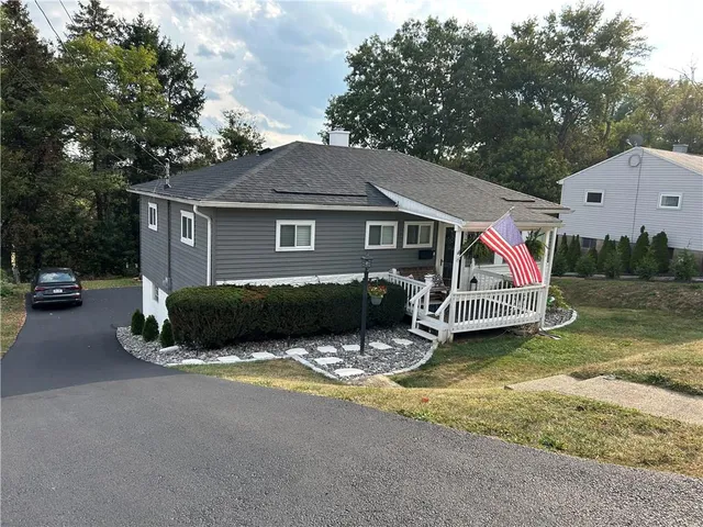 a view of house with outdoor space and porch
