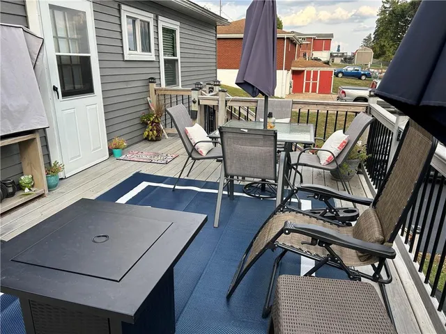 a patio with table and chairs