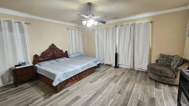 a bedroom with a bed and window