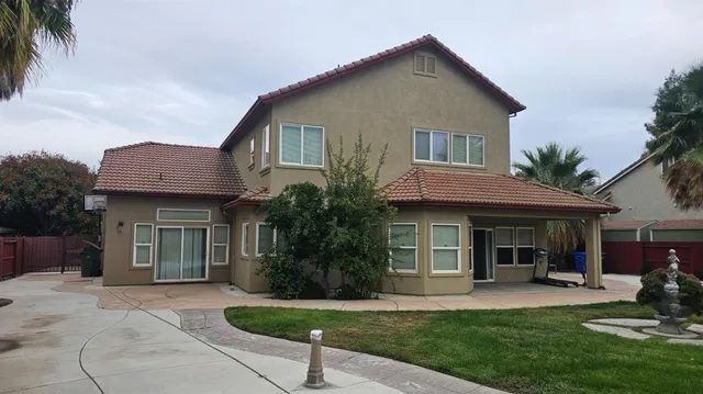 a front view of a house with a yard and porch