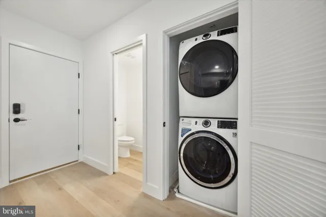 a view of a hallway with washer and dryer
