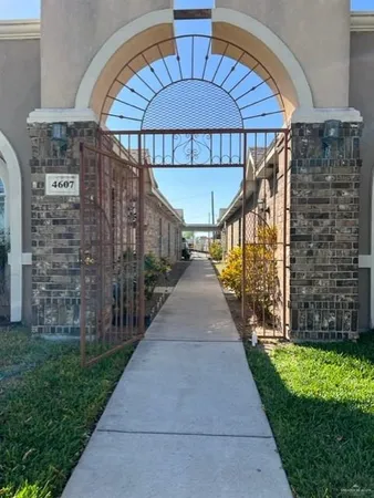 a view of a patio with a yard