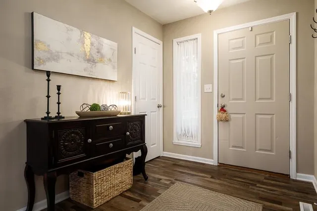 a room with furniture and wooden floor