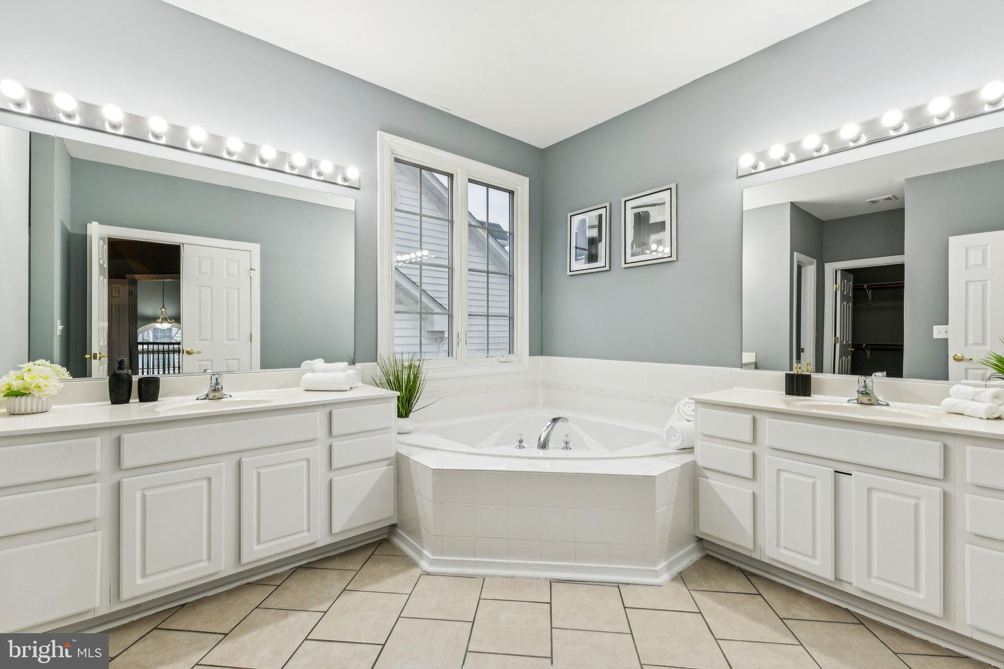 16363 Rusty Rudder Drive Woodbridge, VA 22191 - Photo 23 of 40 a view of a double vanity sink mirror and window