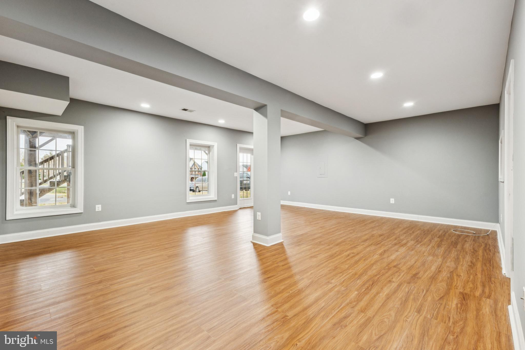 16363 Rusty Rudder Drive Woodbridge, VA 22191 - Photo 32 of 40 an empty room with wooden floor and windows
