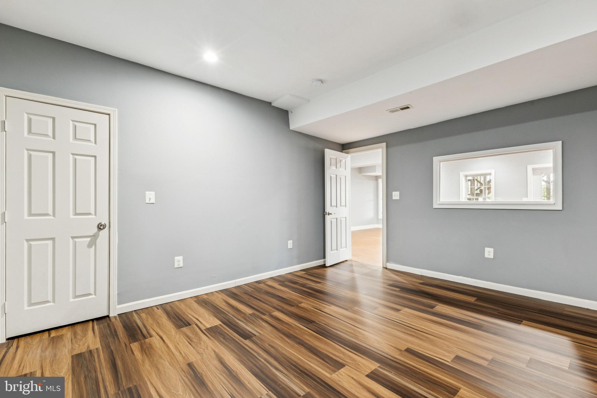 16363 Rusty Rudder Drive Woodbridge, VA 22191 - Photo 35 of 40 wooden floor in an empty room with a window