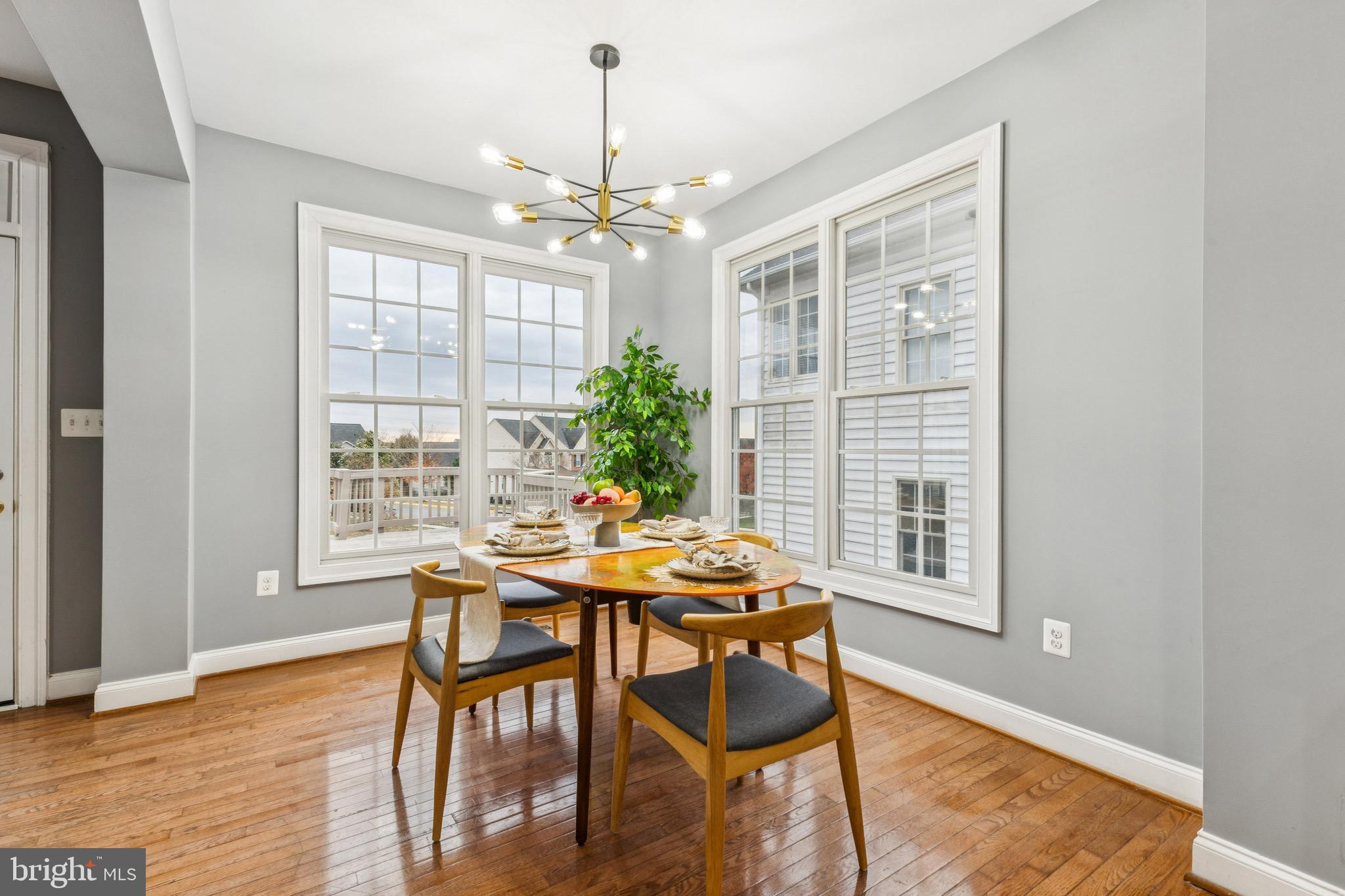 16363 Rusty Rudder Drive Woodbridge, VA 22191 - Photo 9 of 40 a view of a dining room with furniture window and wooden floor