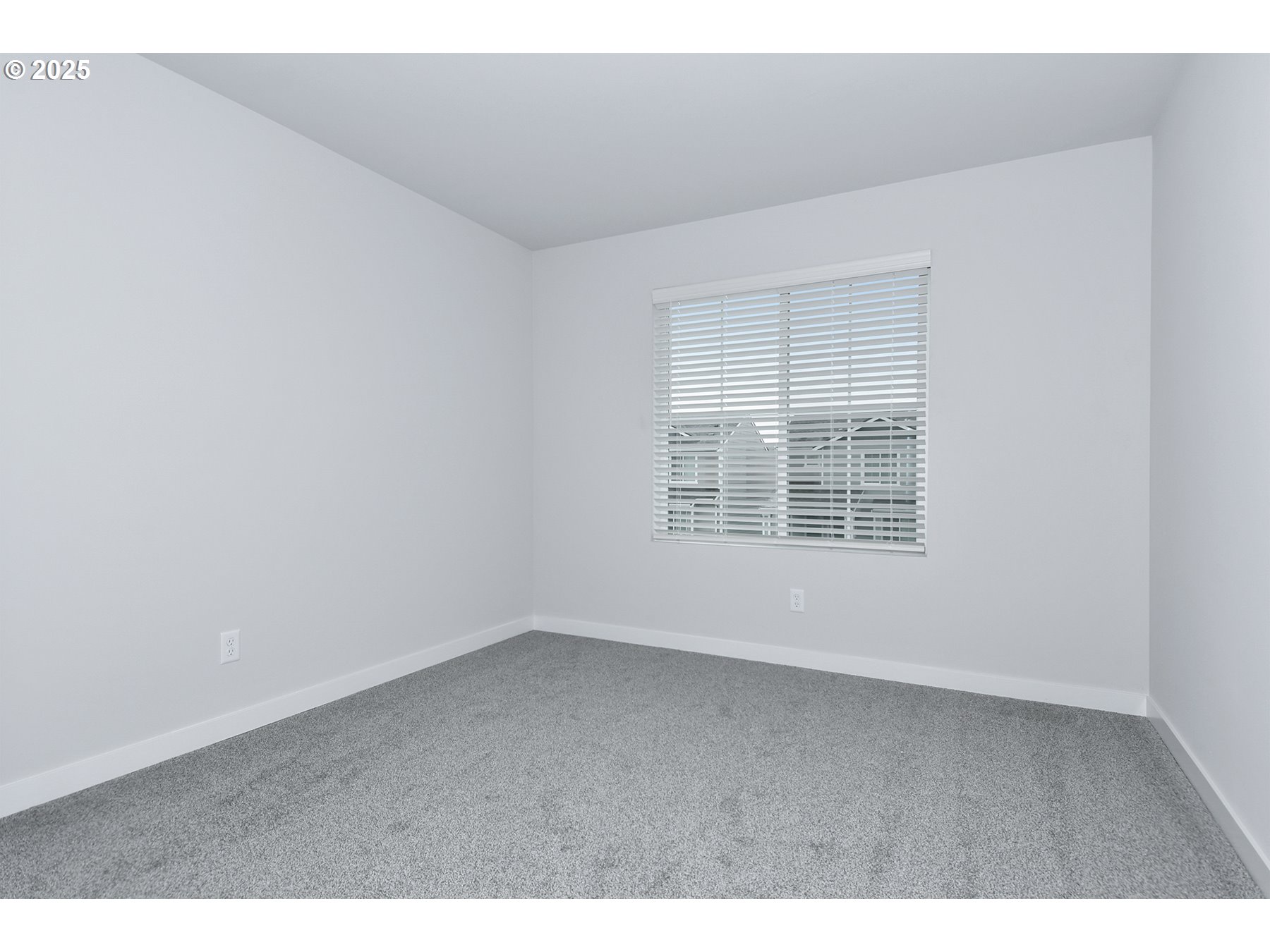 1375 Owl Avenue Woodburn, OR 97071 - Photo 19 of 20 an empty room with wooden floor and windows