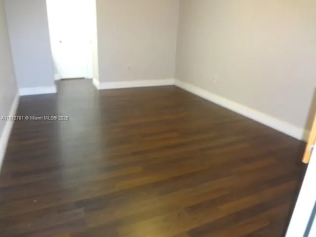 a view of a small space with wooden floor