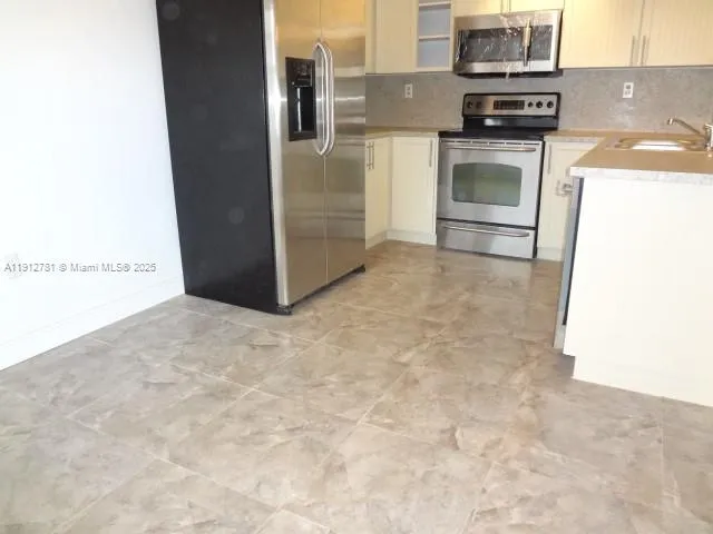 a view of a kitchen with a stove