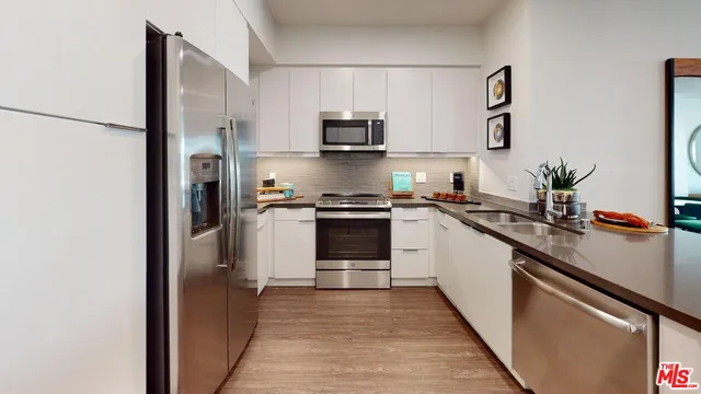 a bedroom with bed and wooden floor