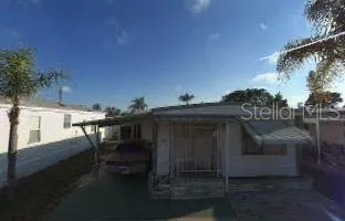 a view of dinning table and chairs in patio