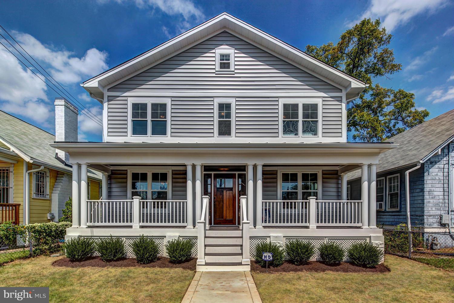 859 Venable Place Northwest Washington, DC 20012 - Photo 1 of 30 a front view of a house with a yard