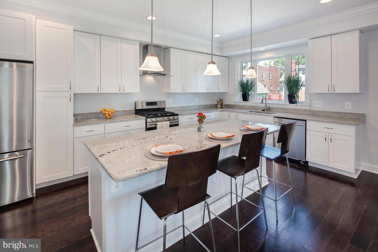 859 Venable Place Northwest Washington, DC 20012 - Photo 13 of 30 a kitchen with a sink a counter space appliances and cabinets