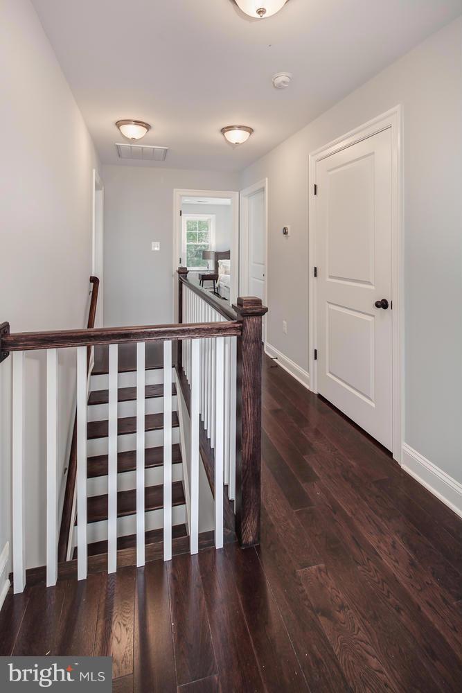 859 Venable Place Northwest Washington, DC 20012 - Photo 16 of 30 a view of a hallway with wooden floor and windows