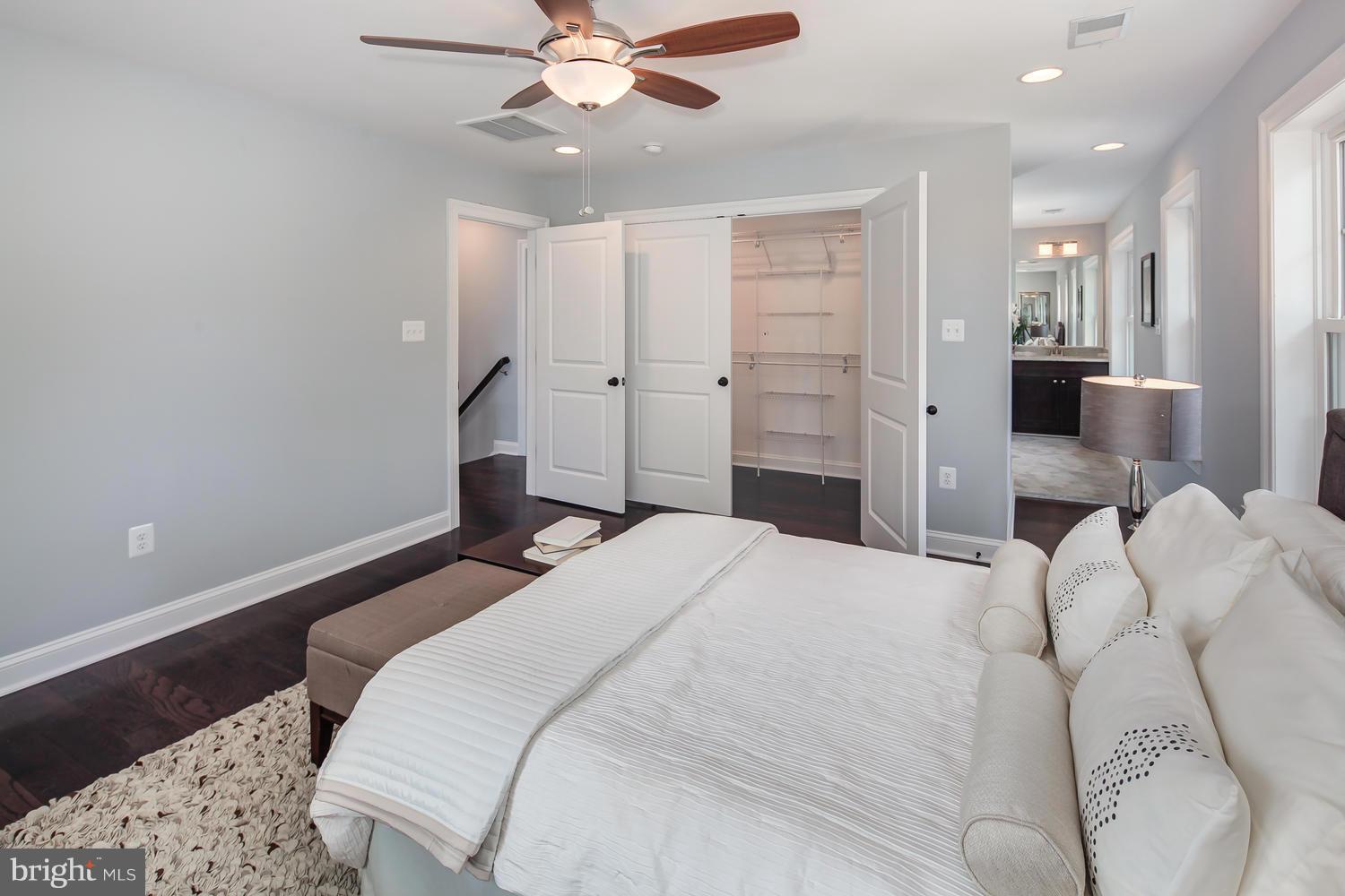 859 Venable Place Northwest Washington, DC 20012 - Photo 18 of 30 a bedroom with a bed and a chandelier
