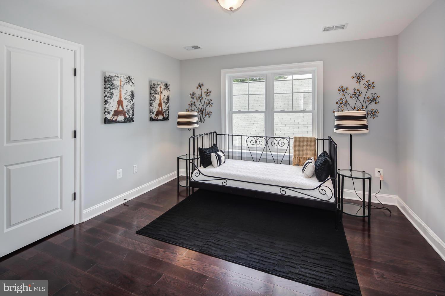 859 Venable Place Northwest Washington, DC 20012 - Photo 20 of 30 a view of a bedroom with furniture window and wooden floor