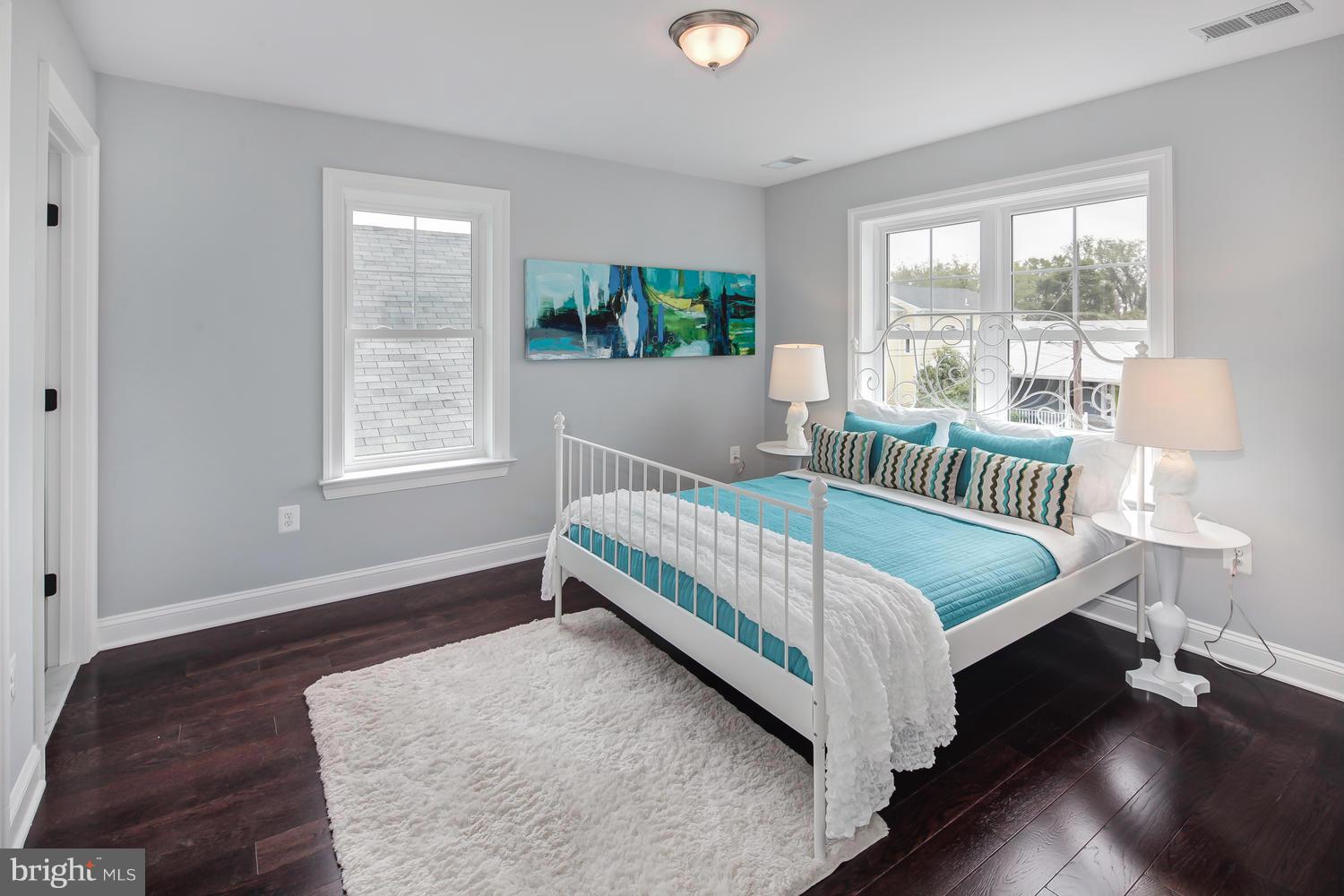 859 Venable Place Northwest Washington, DC 20012 - Photo 21 of 30 a bed sitting in a bedroom next to a window