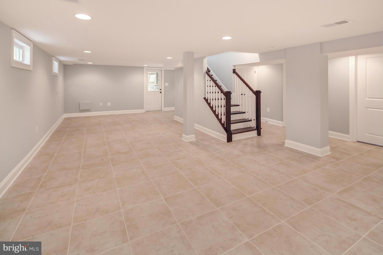859 Venable Place Northwest Washington, DC 20012 - Photo 25 of 30 a view of an empty room with stairs and a window