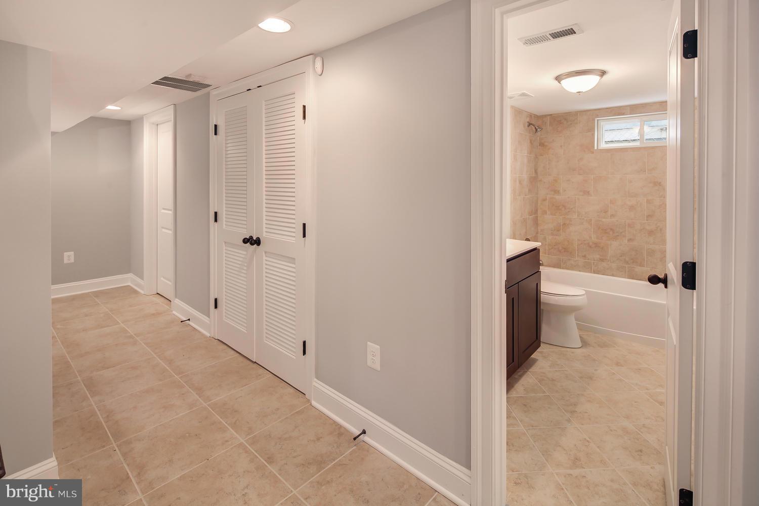 859 Venable Place Northwest Washington, DC 20012 - Photo 26 of 30 a bathroom with a shower and a toilet