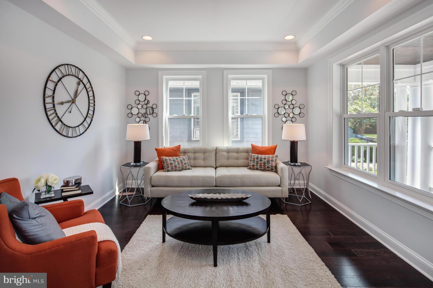 859 Venable Place Northwest Washington, DC 20012 - Photo 4 of 30 a living room with furniture a clock and a large window