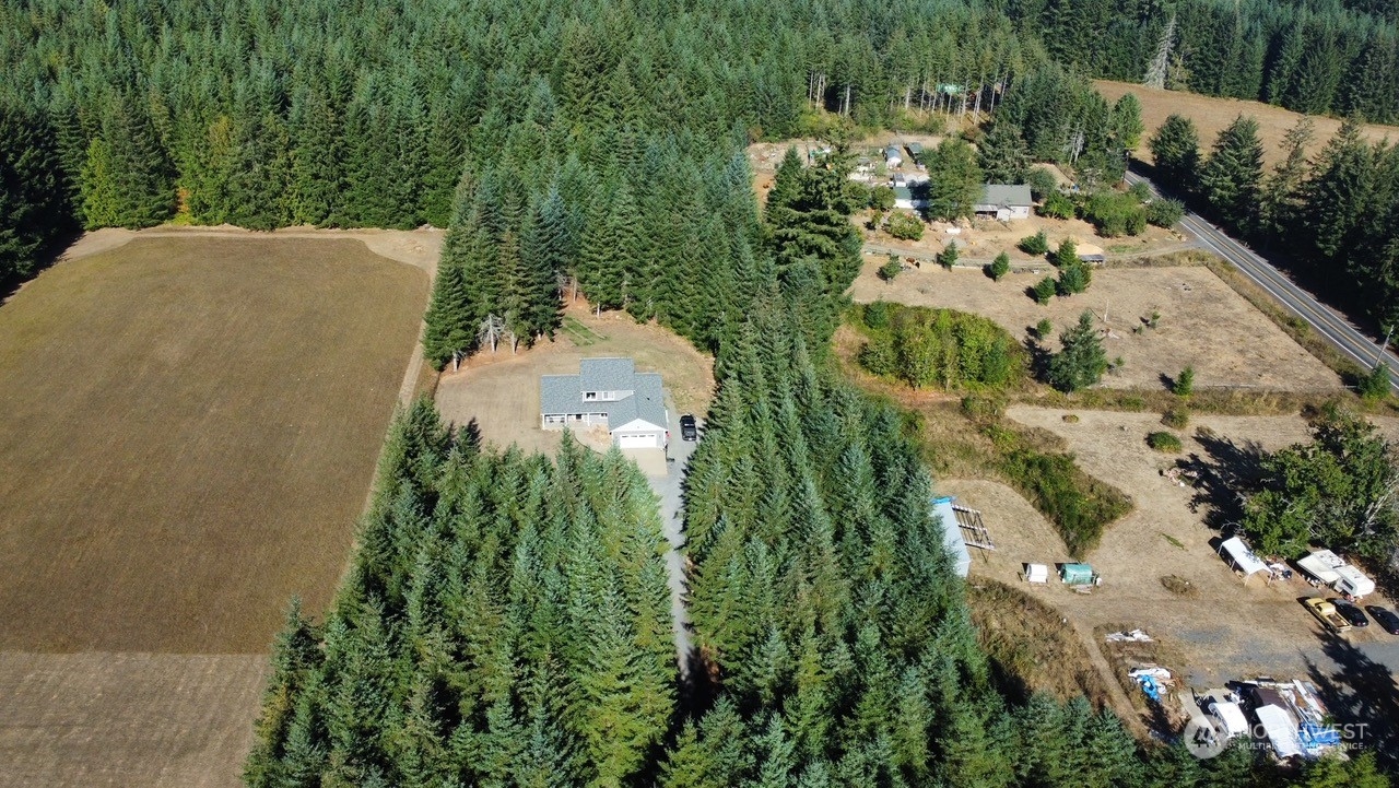 424 Brown Road East Chehalis, WA 98532 - Photo 3 of 25 an aerial view of a residential houses with outdoor space and trees all around