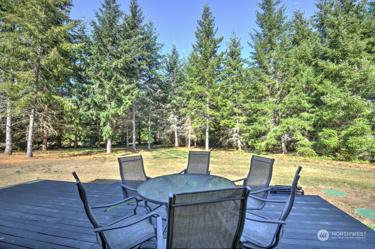 424 Brown Road East Chehalis, WA 98532 - Photo 7 of 25 a view of a lake with a table and chair