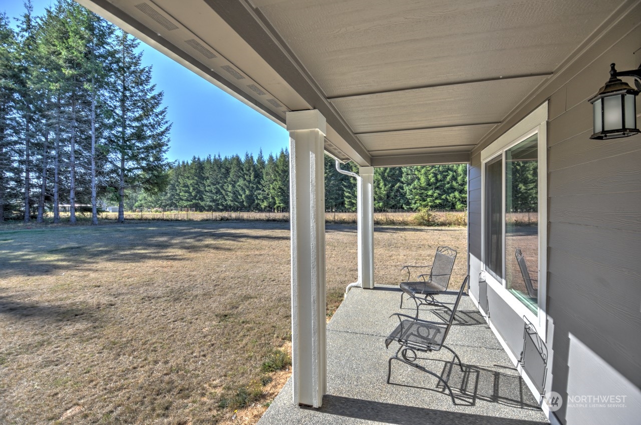 424 Brown Road East Chehalis, WA 98532 - Photo 8 of 25 a view of a porch with furniture and floor to ceiling window