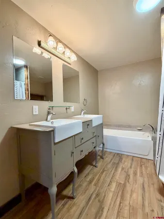 a bathroom with a sink double vanity and a mirror