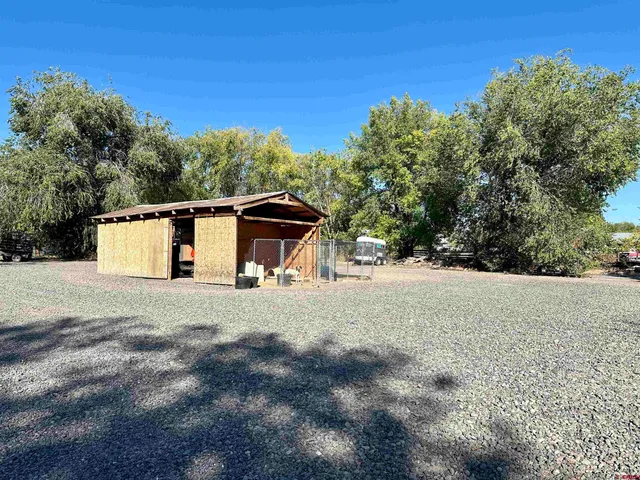 a front view of a house with wooden fence