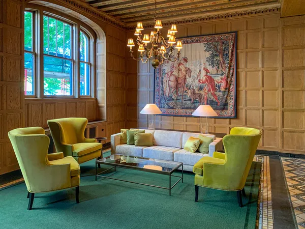 a living room with furniture and a large window