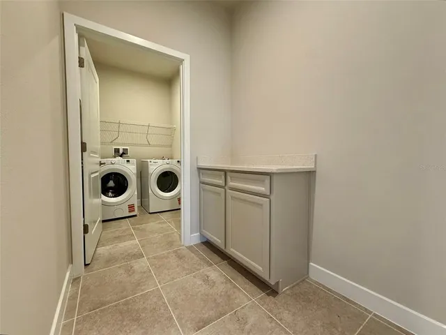 a view of a utility room with washer and dryer