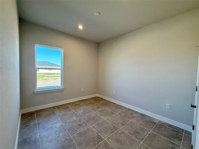 an empty room with a empty space and window