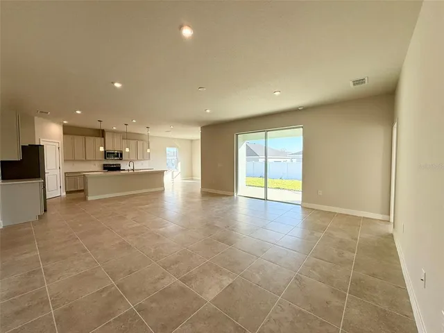 a view of a kitchen with a sink and cabinets