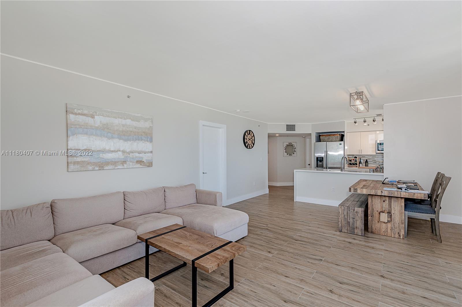 90 Alton Road, Unit 1901 Miami Beach, FL 33139 - Photo 11 of 21 a living room with furniture and view of kitchen