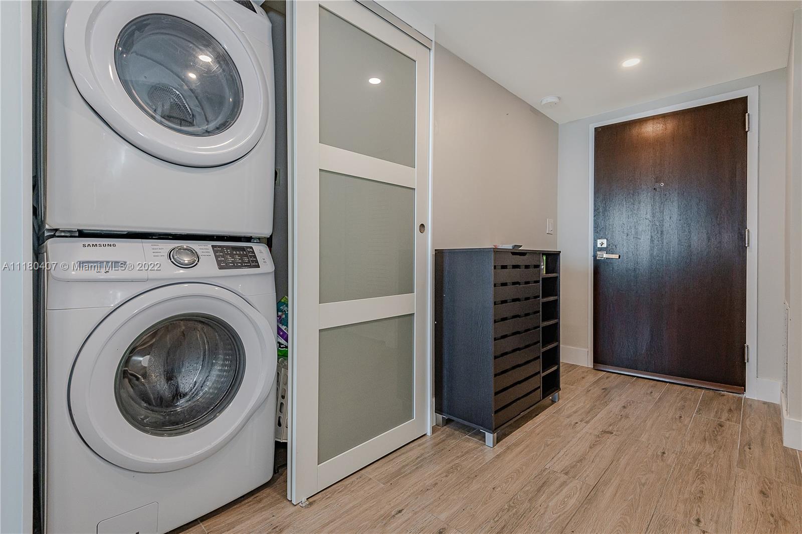 90 Alton Road, Unit 1901 Miami Beach, FL 33139 - Photo 20 of 21 a view of a storage & utility room with washer and dryer