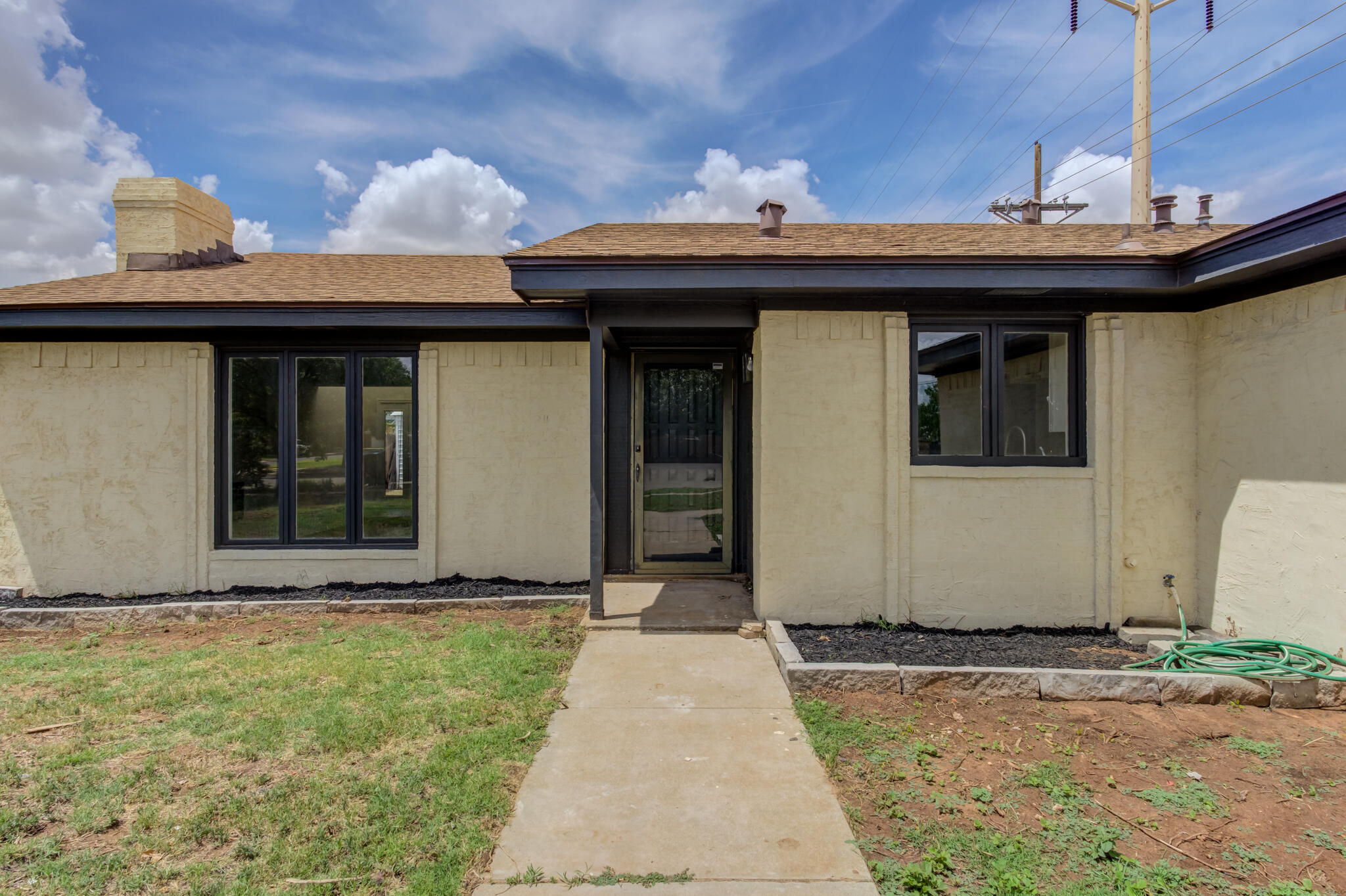 3006 93rd Street Lubbock, TX 79423 - Photo 2 of 35 a view of a house with small yard