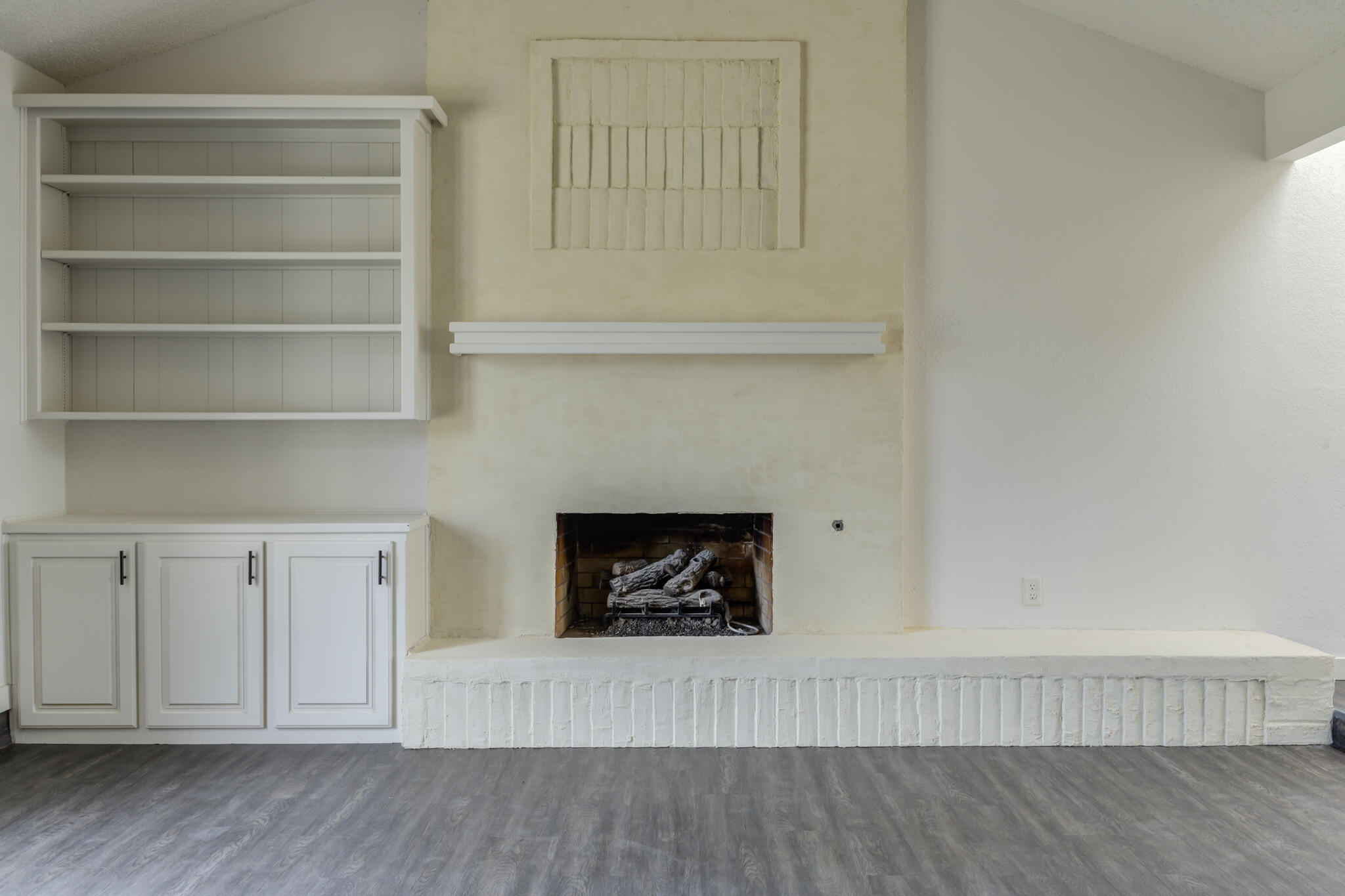 3006 93rd Street Lubbock, TX 79423 - Photo 6 of 35 a living room with furniture and a fireplace