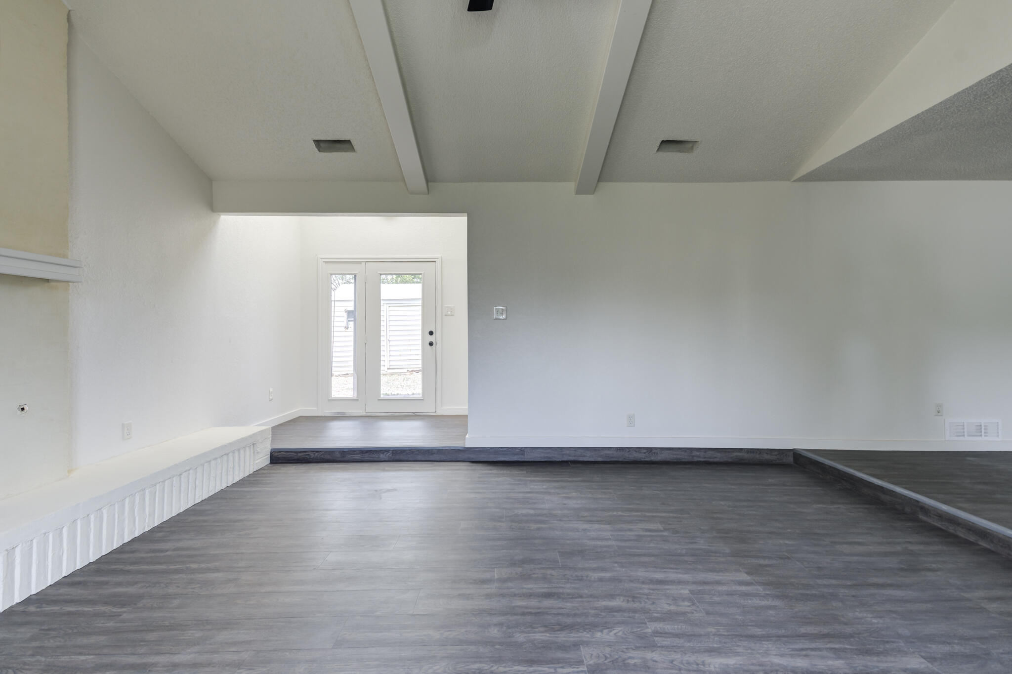 3006 93rd Street Lubbock, TX 79423 - Photo 8 of 35 a view of wooden floor and windows in a room