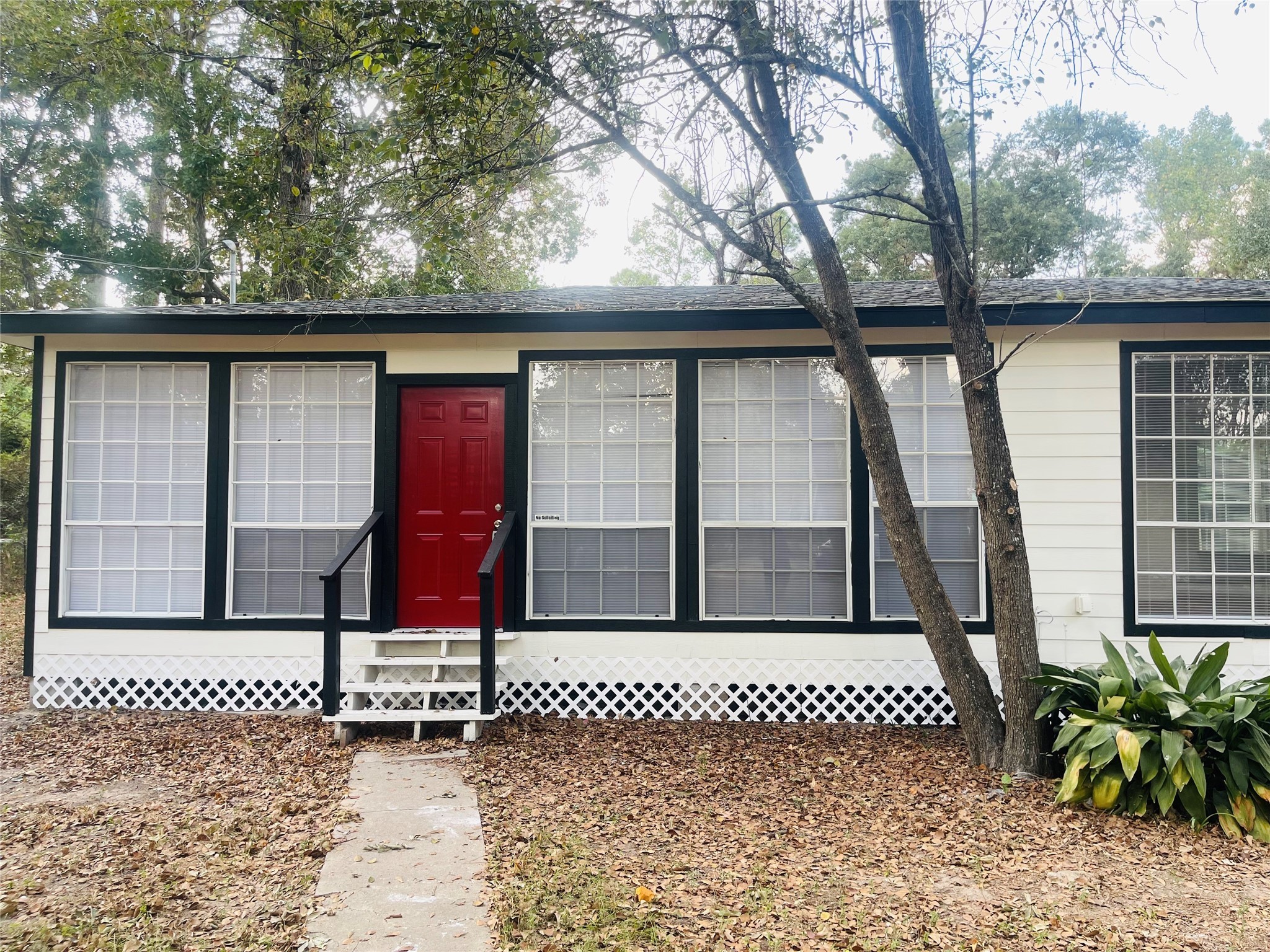 16643 Lake Circle Conroe, TX 77302 - Photo 1 of 47 a front view of a house with a yard